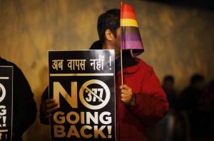 A gay rights activist in New Delhi last year holding up a placard against Section 377 of the Indian Penal Code that criminalizes gay sex. PHOTO: ALTAF QADRI/ASSOCIATED PRESS